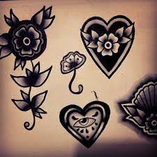 A few hearts lined up with the last heart dripping down like spilled ink. Darling The Only Ghoul In The House Is You Black Heart Tattoos Traditional Tattoo Heart Tattoo
