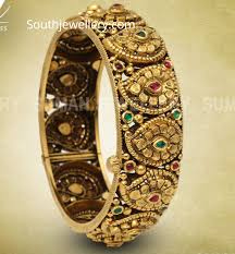 99.5, with creative designs to match present generation with that of traditional to preserve the indian culture, which has played a major role in establishing us as a symbol of trust. Antique Gold Kada Indian Jewellery Designs