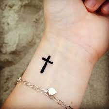 A tiny cross sign can signify your religious faith in a nice way. Pin On Tattoo Ideas