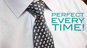 Cross the wide part of the tie over the narrow end, and start to bring it up through the hole between collar and tie. How To Tie A Tie Half Windsor Knot Easy Method Youtube