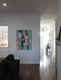 Install the canvas print by applying hot glue to the back corners of the print inside the frame. Diy Timber Frame Canvas