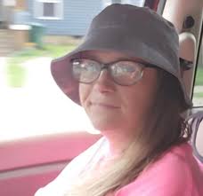 What is the name of the work uniform under the North Face jacket?