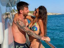 PSG star Lionel Messi shares raunchy snog with bikini-clad wife while on  yacht holiday - Daily Star