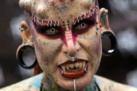 Split tongue, titanium horns and tattoos galore: the lawyer who transformed  herself into 'Vampire Woman'