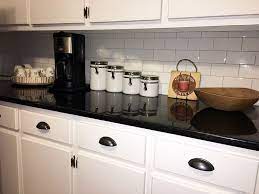 Soho Subway Tile And Black Pearl Granite Black Kitchen Countertops Vintage Tiles Kitchen Black Tiles Kitchen