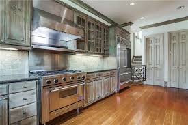 Rustic One Wall Kitchen With Viking Range Wood Floors And Limestone Backsplash One Wall Kitchen Kitchen Designs Layout Kitchen Layout
