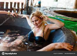 Young Blonde Woman Relaxing Hot Tube Winter Vacation Stock Photo by  ©sinenkiy 223969544