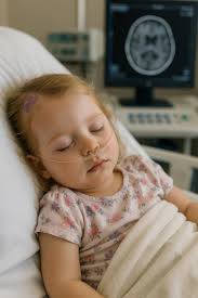 Eloise did so well during her MRI, especially considering she hadn't been  able to eat since midnight. She even handled waking up afterward with such  strength, though eventually the drowsiness caught up