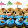 How to decorate beach themed cupcakes with edible sand, buttercream waves and tropical flowers. 3