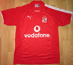 Trims have been popped out in a gold colour, giving the kit a rich and heroic feel. Al Ahly Home Football Shirt 2004 2005 Sponsored By Vodafone