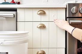 Heat a damp micro cloth in a microwave for 35 seconds, then use it to quickly wipe away the grease layer. How To Get Sticky Cooking Grease Off Cabinet Doors Kitchn