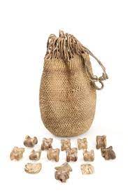 Sangoma S Bag For Divination Containing 30 Animal Vertebrae 2 Pebbles A Hoof 2 Pieces Of Carved Bone And A Nut Shell Divination Bone Carving Bags