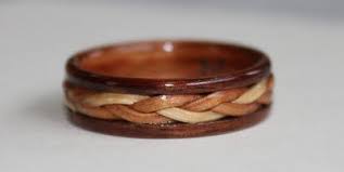 Wear The Warmth Of Wood Wooden Rings And Wild Flowers Wooden Wedding Ring Wood Rings Wooden Rings Engagement