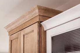It is also used atop doors, windows, pilasters and cabinets. Schuler Wide Crown Molding Shown In Dalton Quartersawn Oak Cappuccino And Cottage Cabinets With Crown Molding Kitchen Cabinet Crown Molding Cove Crown Molding