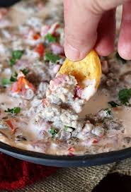Dipping Into Rotel Sausage Dip Image Sausage Appetizers Sausage Queso Queso Dip