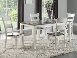 The driness is a modern leg up on the typical gateleg table thanks to clean lines , weathered gray with white finish, and white metal base. Home Holl Furniture