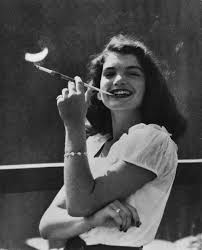The assassination has also been the subject of many time travel and alternate history stories in science fiction film, television and literature, many with kennedy and/or oswald surviving or other people in the presidential. 22 Year Old Jacqueline Bouvier Later Kennedy Blowing Smoke Rings 1951 Oldschoolcool