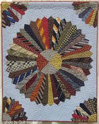 It was my first time tying and it's really easy — you just use embroidery thread to make little knots here and there to hold the layers together. Quilt Inspiration Scrap Happy Quilts From Dad S Shirts And Ties