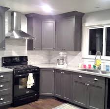 Grey Cabinets Black Appliances Silver Hardware Full Tile Backsplash Really Good Examp Kitchen Cabinet Design Kitchen Renovation Black Appliances Kitchen
