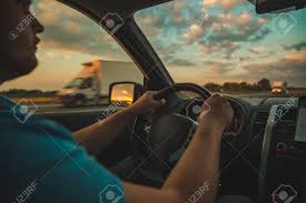 Find the perfect sunset road trip stock illustrations from getty images. Man Driving Car By Highway On Sunset Road Trip Stock Photo Picture And Royalty Free Image Image 111080898