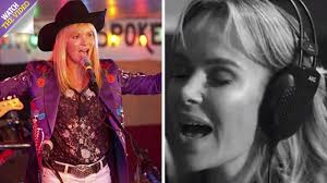 Amanda Holden shows off her holiday tan as she takes a break from Britain's  Got Talent auditions to visit theatre