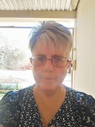 New hairstyle for women over 60 with gray hair and black stripes