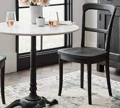 It features the double drop leaf bistro table and two classic chairs with padded seats. Perfect Pair Rae Marble Bistro Table Cline Chair Pottery Barn Indoor Bistro Table Bistro Table Set Bistro Table Decor