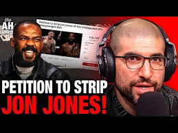 Petition to STRIP Jon Jones Goes Viral, Tom Aspinall Makes ‘Champion’  Announcement, Helwani Reacts
