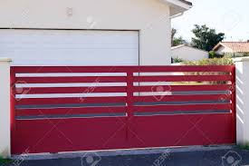 Modern house plans feature lots of glass, steel and concrete. Red Design Metal Aluminum Gate Of Modern House Stock Photo Picture And Royalty Free Image Image 138225870