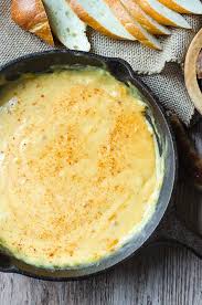 A Cast Iron Pan Filled With Beer Cheese Dip Beer Cheese Beer Cheese Dip Beer Cheese Dip Recipe