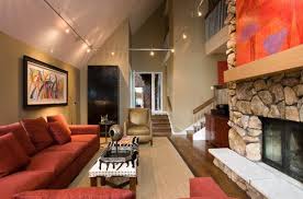 • this is a very discreet and efficient solution if you have a small room with a sloped ceiling. Gorgeous Track Lighting Ideas For The Contemporary Home Living Room Lighting Rustic Living Room Design Vaulted Ceiling Lighting