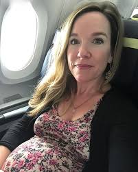 Elle Knox was escorted from the plane after deciding to make an impassioned  address as it landed.