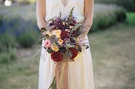 There are many flower varieties in different hues of red ideal for wedding bouquets. Dark Red And Purple Bridal Bouquet Photo By Jennifer Ballard Photography Wedding Inspiration Board Junebug Weddings