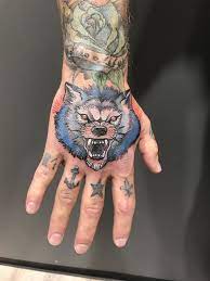 My Neo Traditional Blue Wolf Hand Tattoo Hand Tattoos Traditional Tattoo Hand And Finger Tattoos