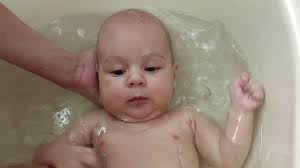 How to bathe a newborn? Active Three Month Old Baby Boy Take A Baby Bath Mom Holds His Head Stock Video Footage Storyblocks