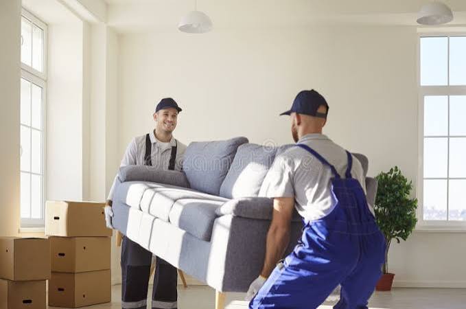 EasyGo movers unloading and placing furniture inside a new home in Mauritius