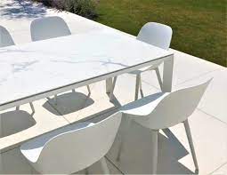 As a general rule, extending dining tables fall into two camps: Abonne Carrara Ceramic Extendable Dining Table