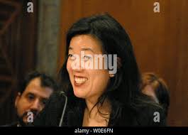 D.C. Public Schools Chancellor Michelle Rhee speaks alongside D.C. Mayor  Adrian Fenty and parents and students at Maury Elementary School following  a walks to school event in Washington