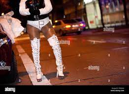 A street prostitute waiting for clients in the Hansastrasse Stock Photo -  Alamy