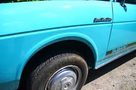 Image result for Herald Yellow 1976 Subaru