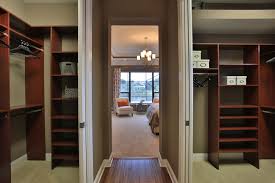 It's a great choice of dark wood and dark grey patterned floors, with only a white wall for contrast. Master Bedroom Closet Design Ideas