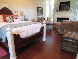 Small eclectic master laminate floor and brown floor bedroom photo in toronto with green walls. Master Bedroom Laminate Flooring Reveal Beckwith S Treasures