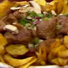 Narda suele cocinar en sus viajes, así que fue difícil elegir solo una cocina inusual. Disco De Arado Bondiola A La Cerveza Y Pollo Con Mil Vegetales Cocineros Argentinos