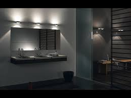 In this art deco pad in chicago, the master bath's custom vanities are in belgian black marble supported by bronze legs; Modern Bathroom Vanity Lighting Youtube