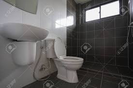 We've found 19 striking black and white bathroom ideas for a modern, monochrome bathroom scheme. Modern Design Of Small Bathroom With White Lavatory Water Closet And Used Black Tile Wall And Floor Stock Photo Picture And Royalty Free Image Image 139266268
