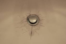 cracked and dirty bathroom sink drain