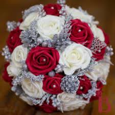 Bridal bouquet is covered with elegant silver crystal and pearl brooches and pearls. Wedding Flowers Silk Wedding Bouquets With Red Flowers