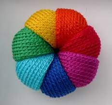 Free knitting pattern for a rainbow ball toy by designer carlã© dehning for nurturing fibres. Crochet Rainbow Flower Toy Good Toy For A Baby Knitting And Crocheting Idea Masterskaya Kolyuchki Vyazanaya Igrush Hand Knitting Yarn Knitting Knitting Charts