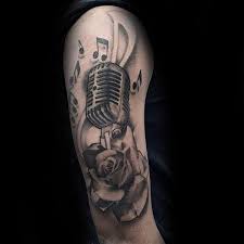 A tattoo that depicts the picture of long pieces of musical notes surrounded with classy red roses is an excellent and great idea for music tattoos. 115 Creative Musical Note Tattoo Designs Body Art Guru