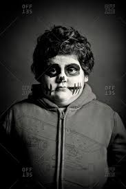 boy in day of the dead makeup stock